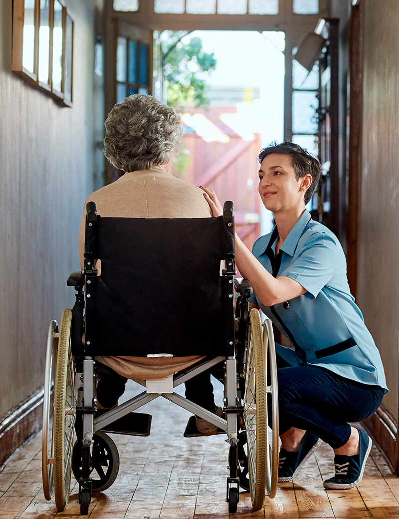 Shot of a nurse caring for a senior patient in a retirement home